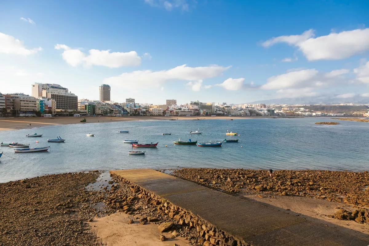 Small boats in the bay at Las Canteras, with the city behind